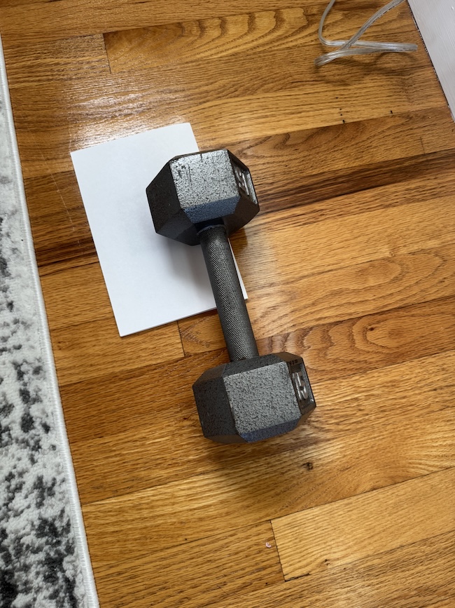 Pressing down cards to avoid warping
